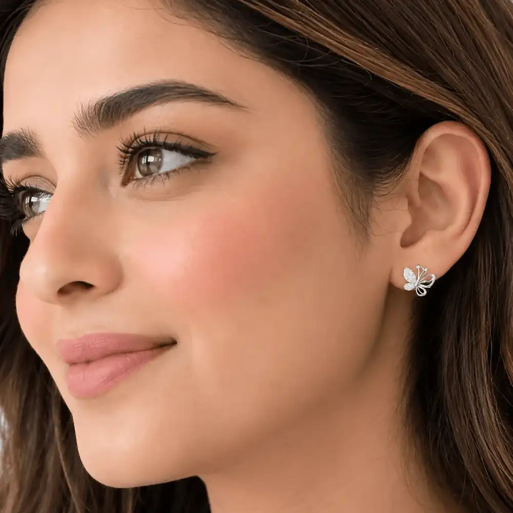 925 Silver Butterfly Stud Earrings 3 Butterfly Stud Earrings in 925 silver worn on ear