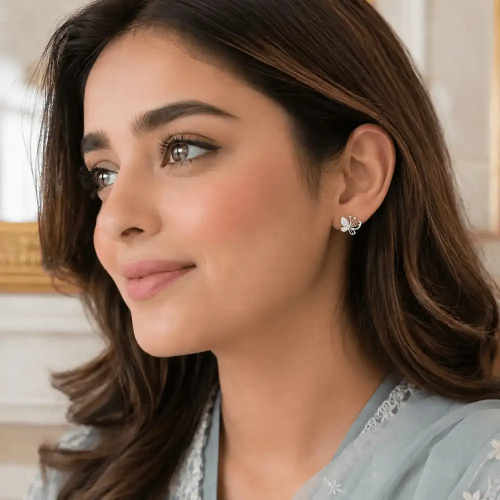 Butterfly Stud Earrings in 925 silver worn on ear