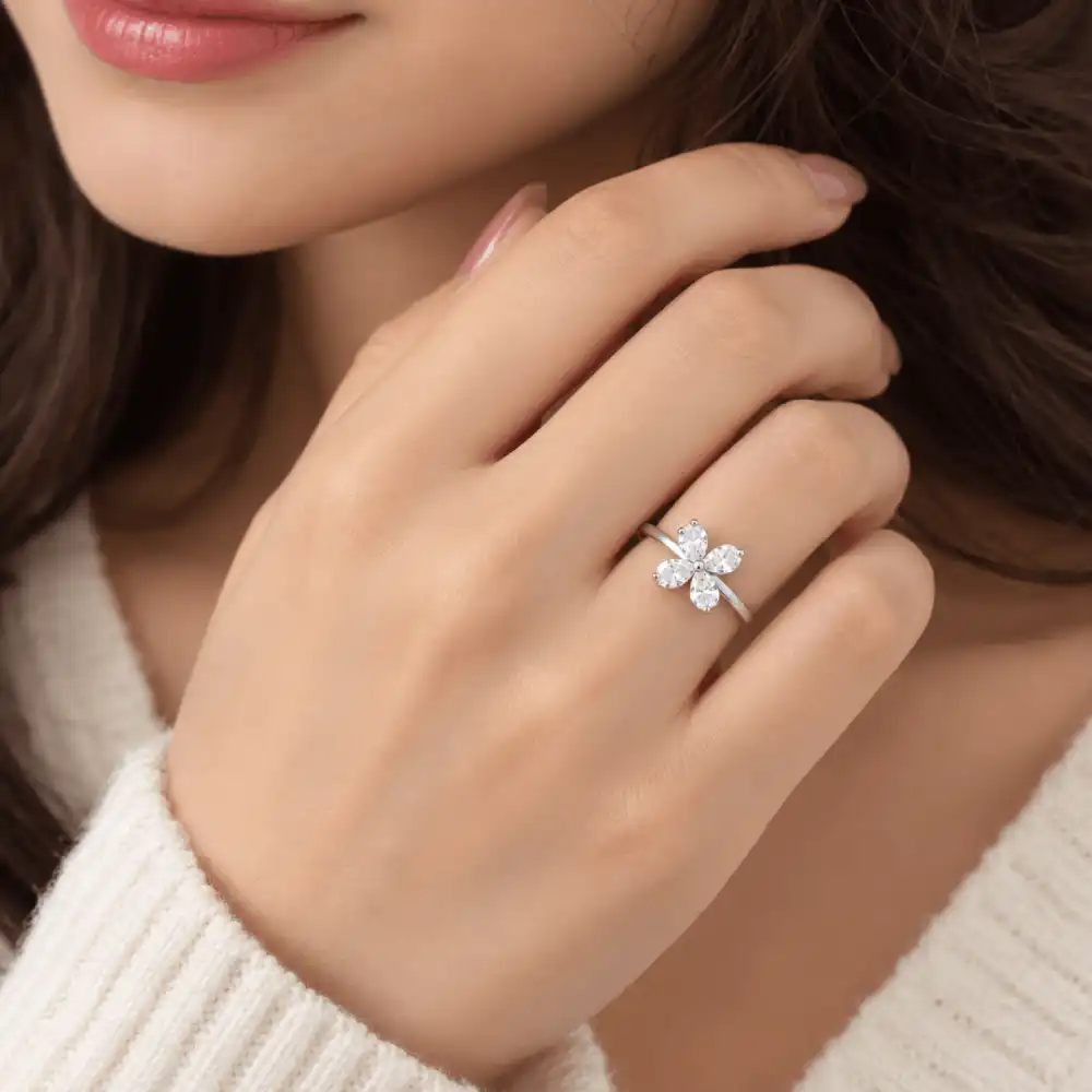 Silver Flower Ring with Zircon Petals 2 Woman wearing silver flower ring with white zircon stones